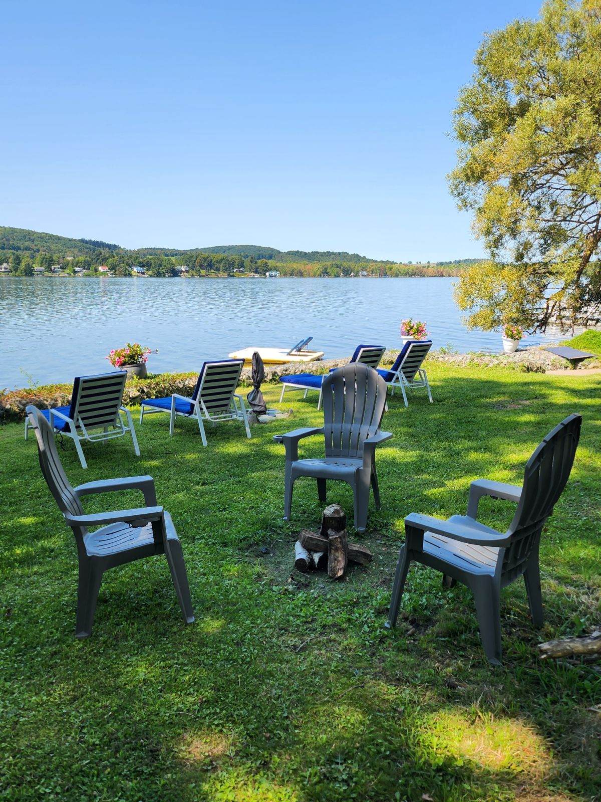 Firepit and waterside lounge chairs