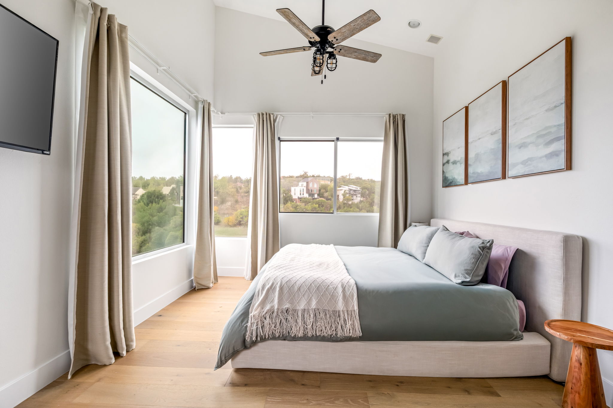 Spacious primary suite with king bed and plenty of natural light