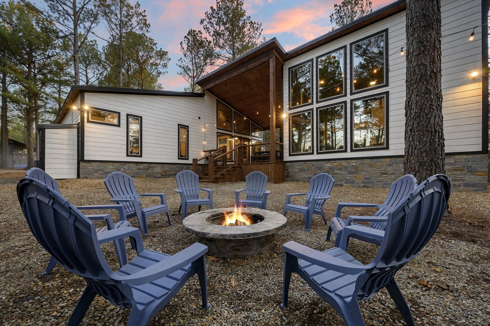 Gather ‘round the firepit as the sun sets and stories begin — a perfect evening under the pines.