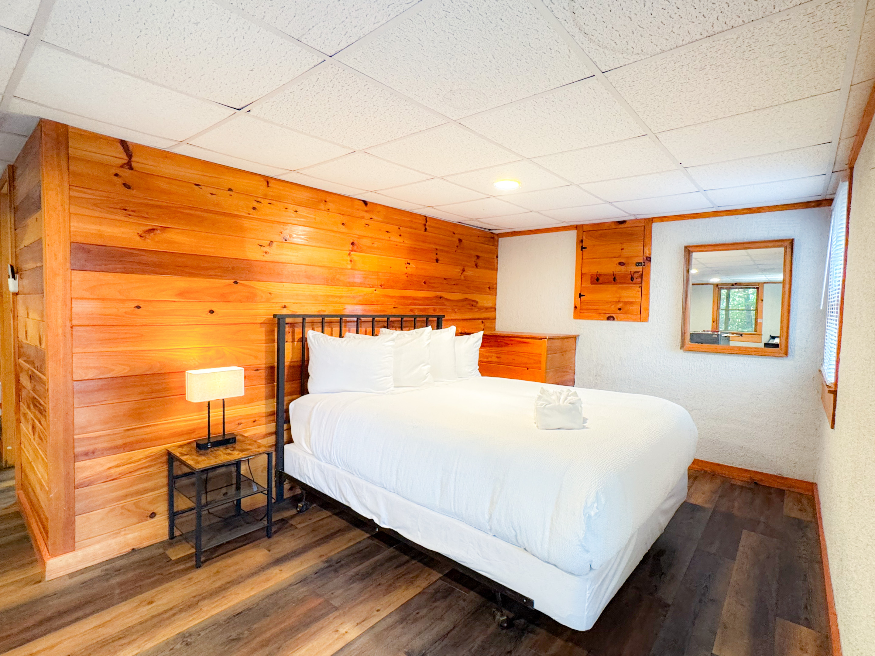 The lower level bed is open concept bedroom on the lower level game room. Please note there is no door but a partition is available for guest use if needed. 