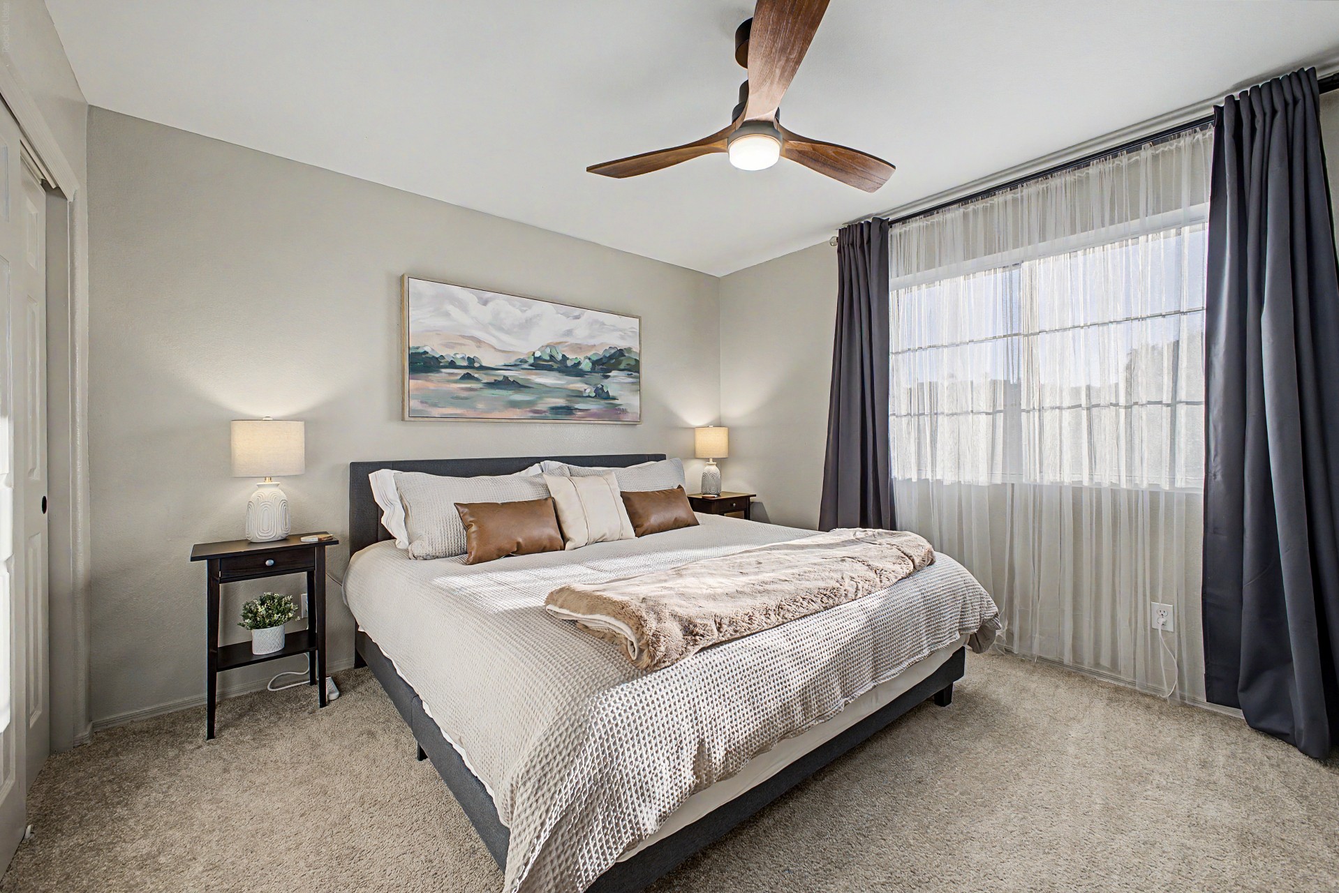 King bedroom 3 upstairs with 55" Smart TV, blackout curtains and ceiling fan
