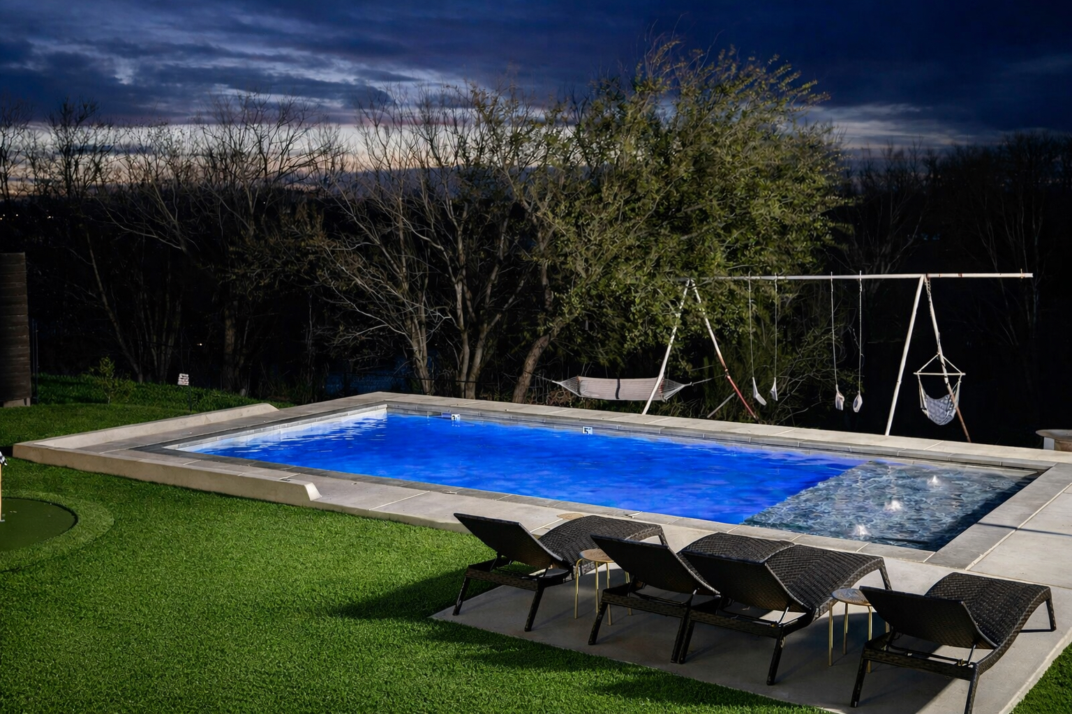 The pool at night offers a peaceful escape with glowing water, soft lighting, and a serene atmosphere perfect for evening swims.
