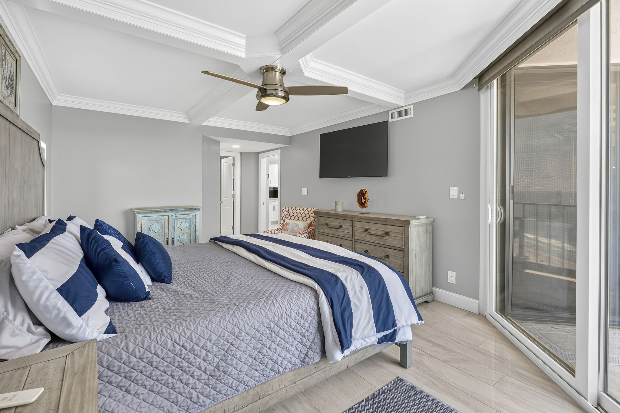 Primary bedroom with King Bed, ensuite bathroom and a private oceanfront balcony