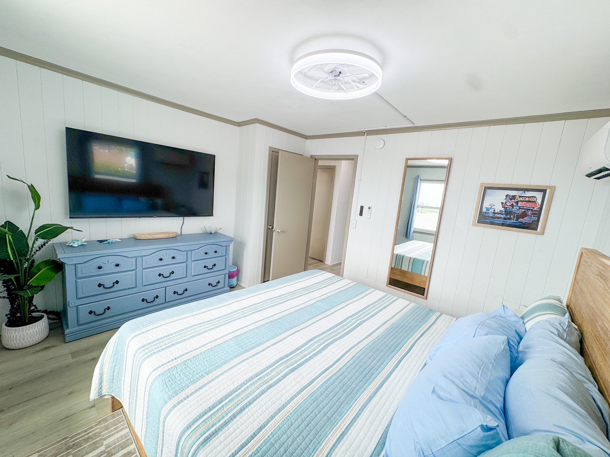 Colorful Primary Bedroom w/65" TV