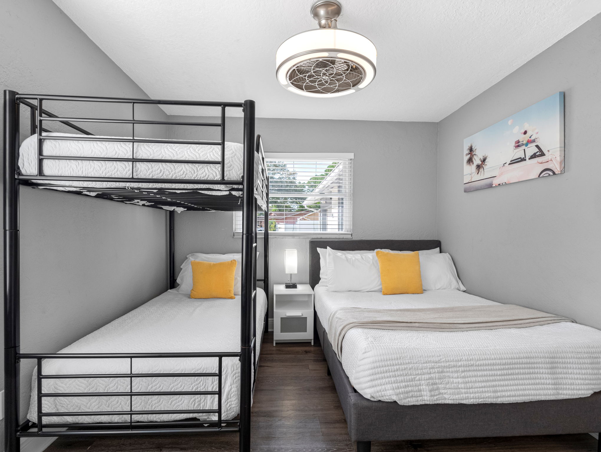 With sleek black metal bunks and crisp white linens, this room is ready for adventure-filled days and restful nights.