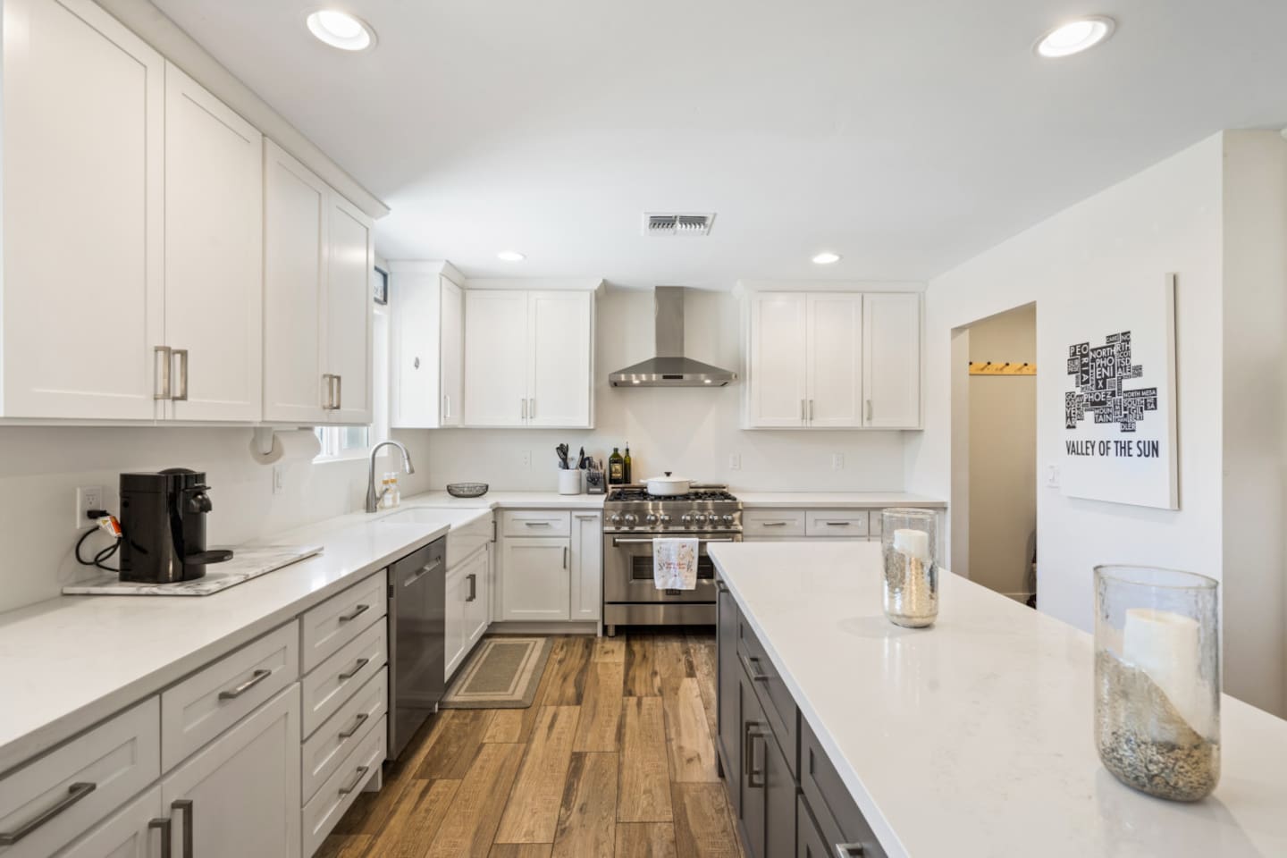 Full kitchen with large island, plenty of storage, and easy access to the dining and living areas. Keurig coffee maker with milk frother and coffee/tea supplies.

