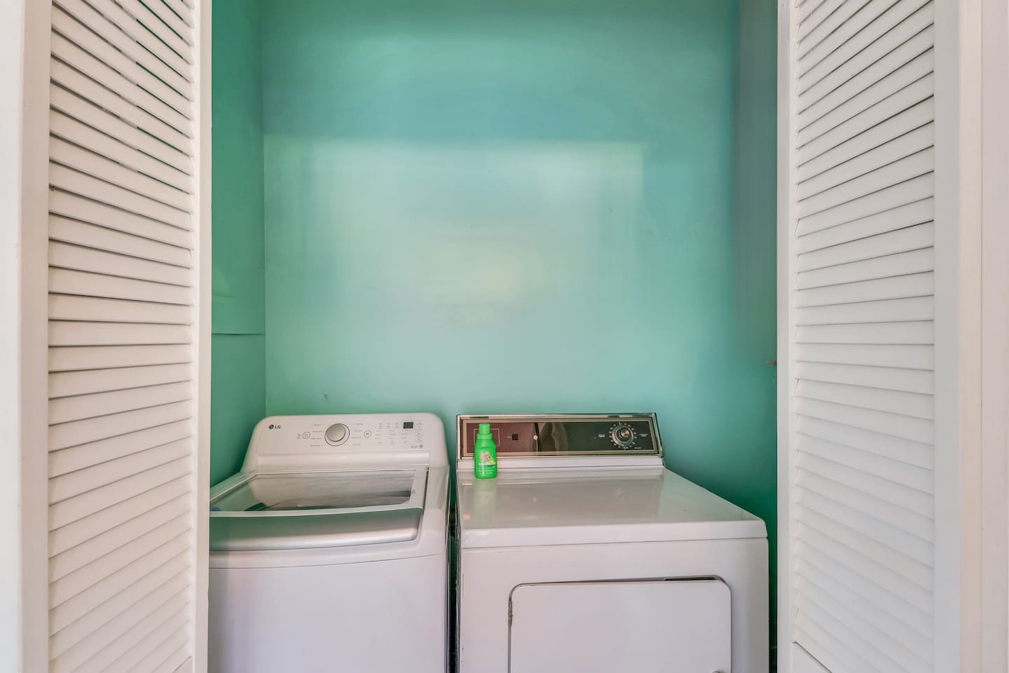 Private laundry closet with washer and dryer—perfect for longer stays and beach days.