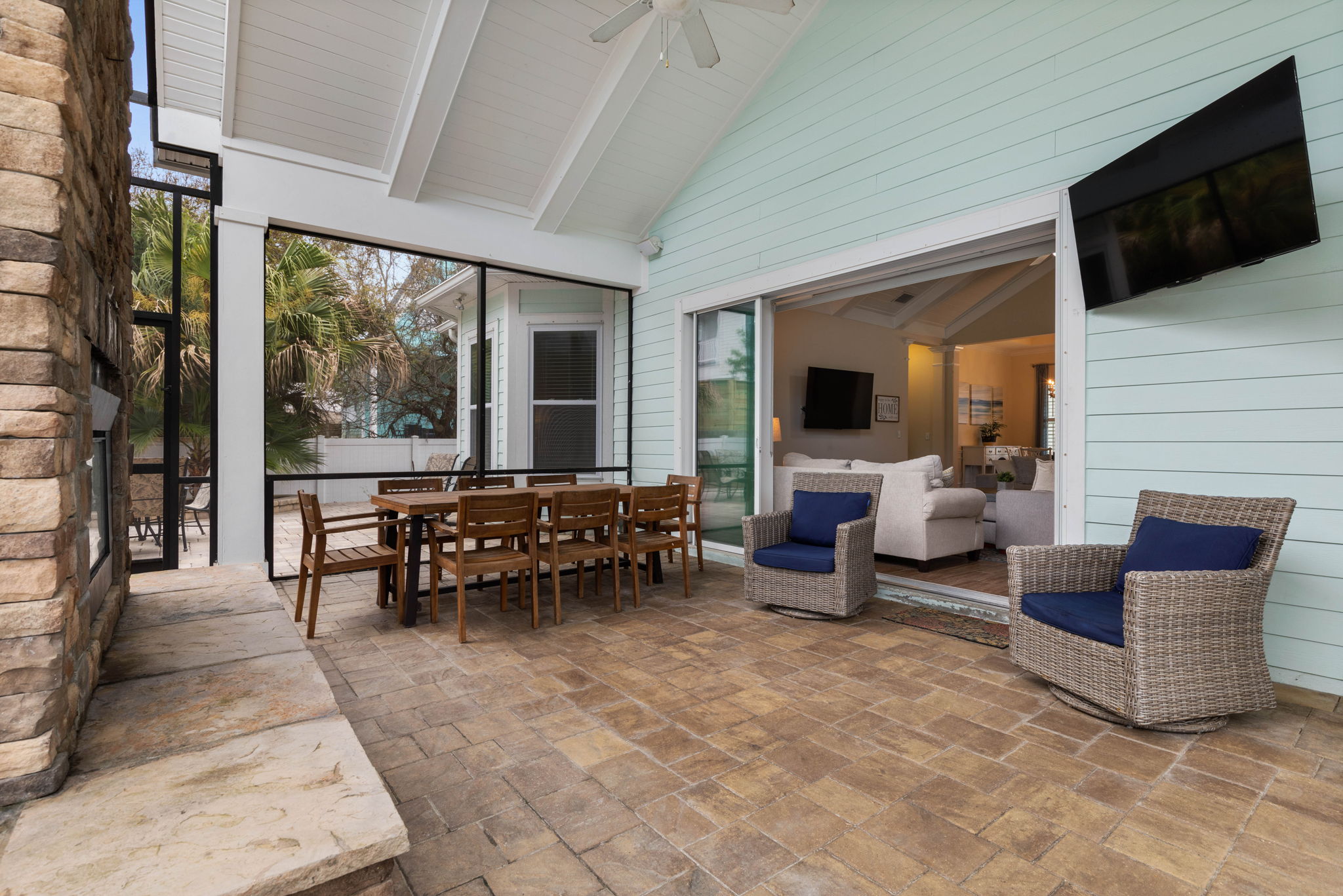 Slide open the doors, gather for dinner by the outdoor fireplace, and let the conversation drift from the lanai to the living room—this breezy indoor-outdoor space was made for slow coastal evenings and unforgettable time together.