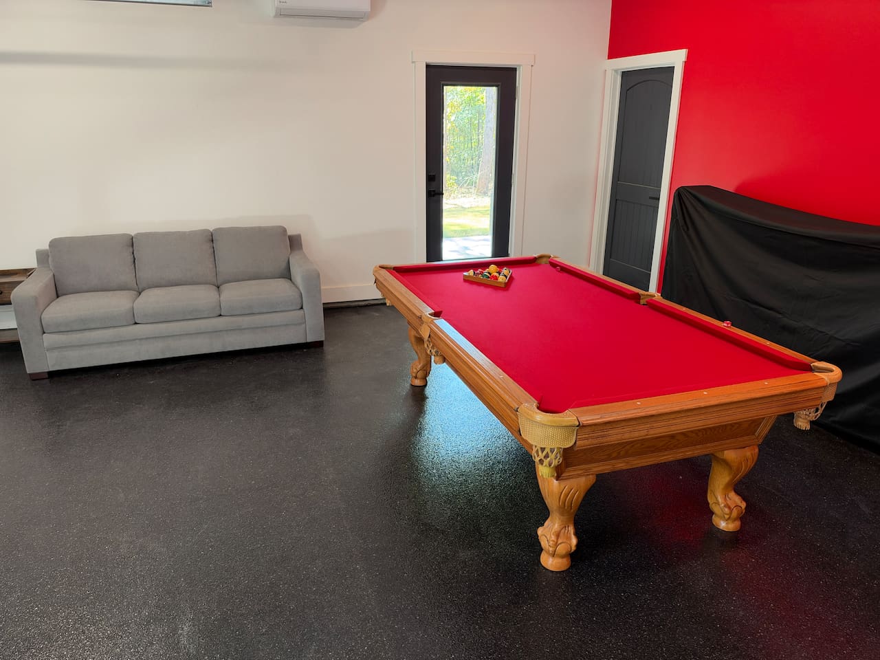 Pool table and queen sofa bed in converted/insulated garage.