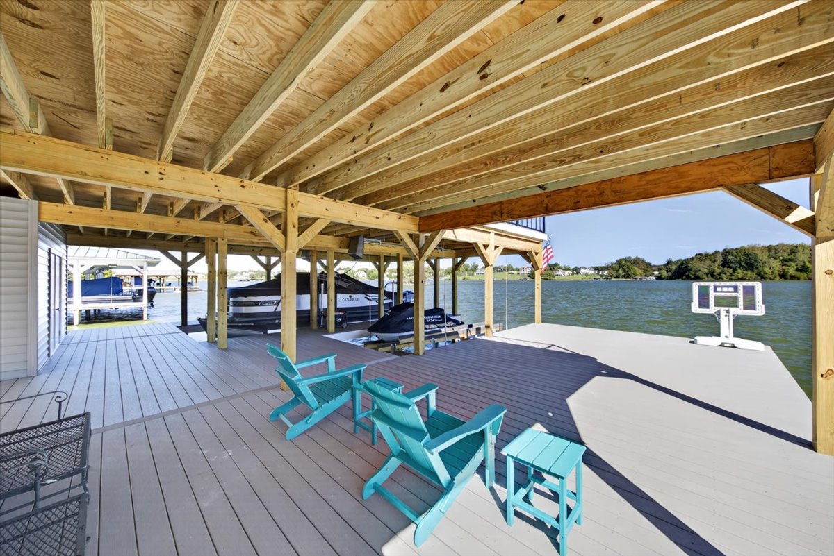 Covered lakeside seating area overlooking the water.