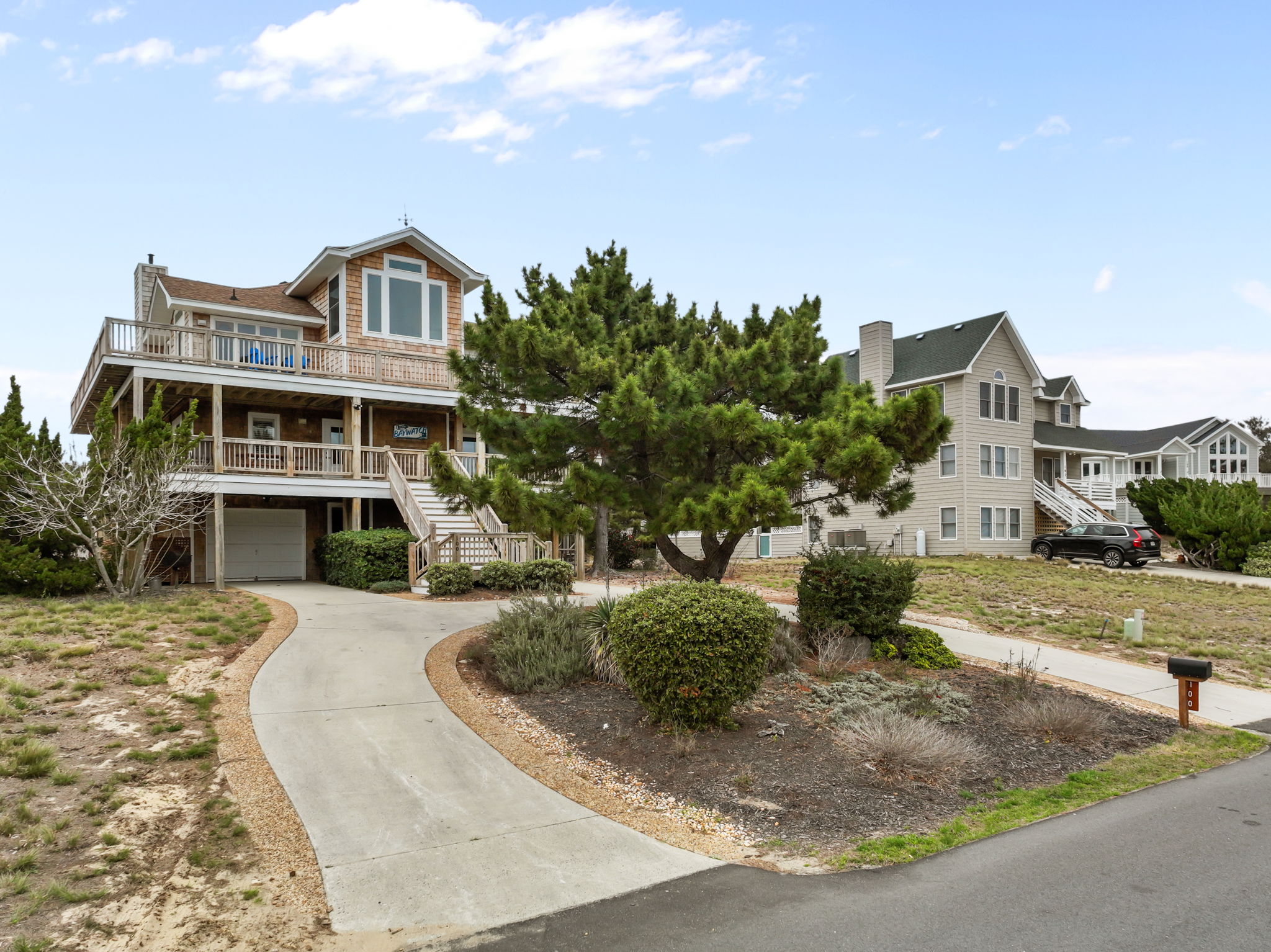 Driveway view as you arrive—tucked in with a bit of privacy.