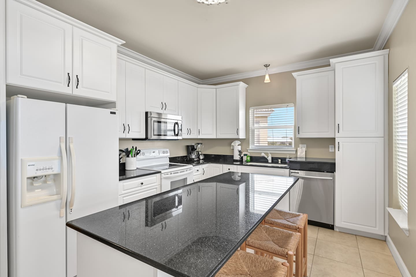 Full Kitchen #2 –  Complete w/ stove/oven, refrigerator, microwave, dishwasher, coffee maker and more + island seating