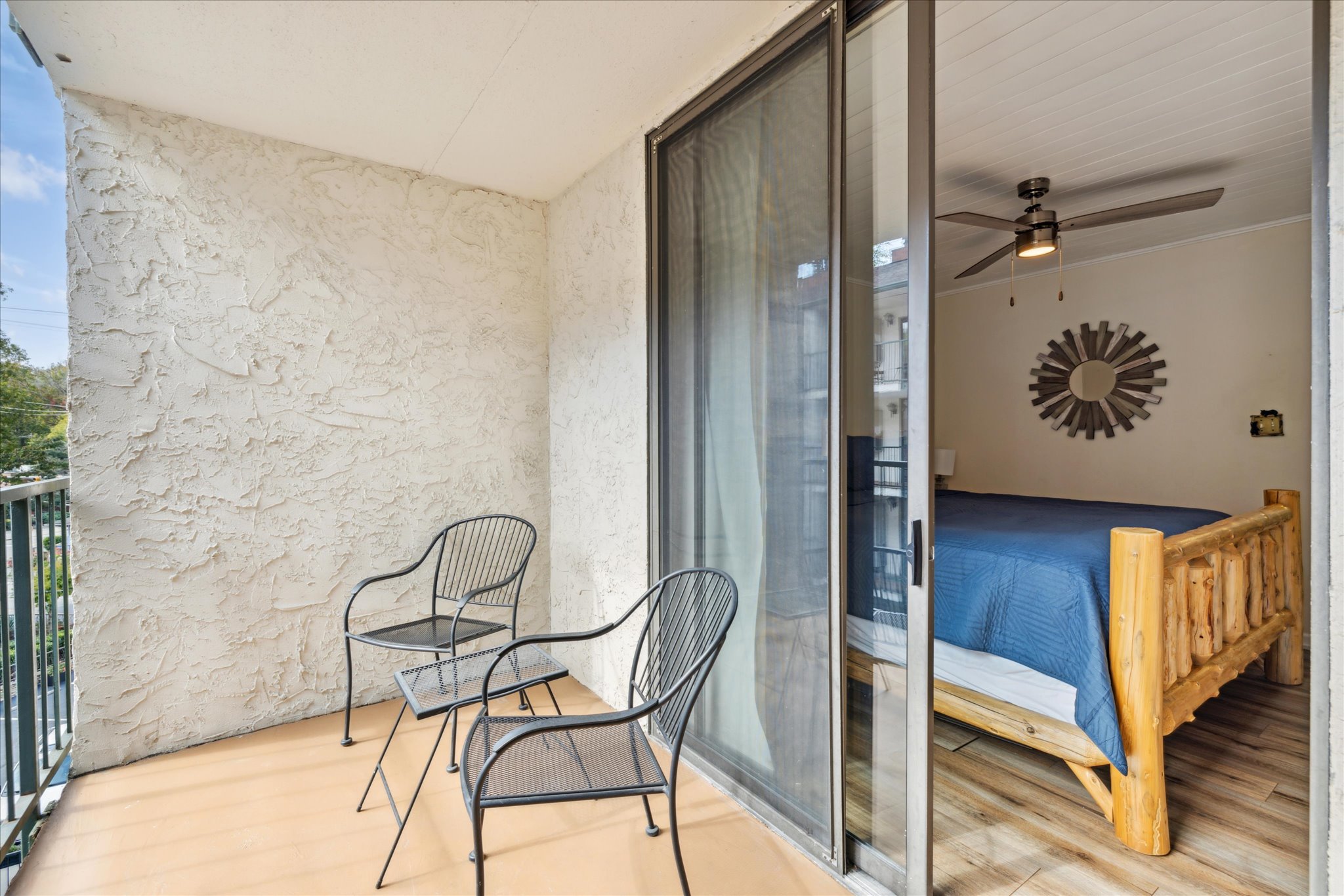 Seating on balcony overlooking pool
