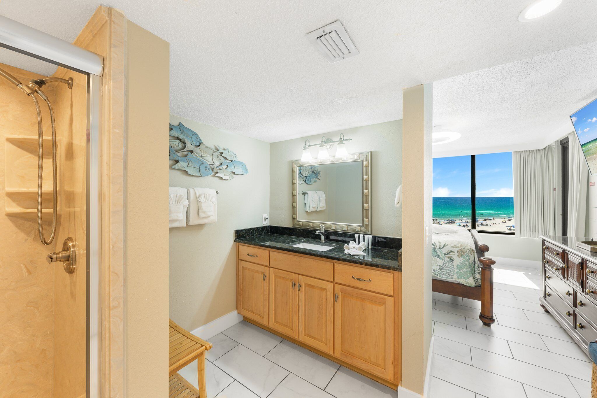 Ensuite bathroom leading into the primary gulf front bedroom