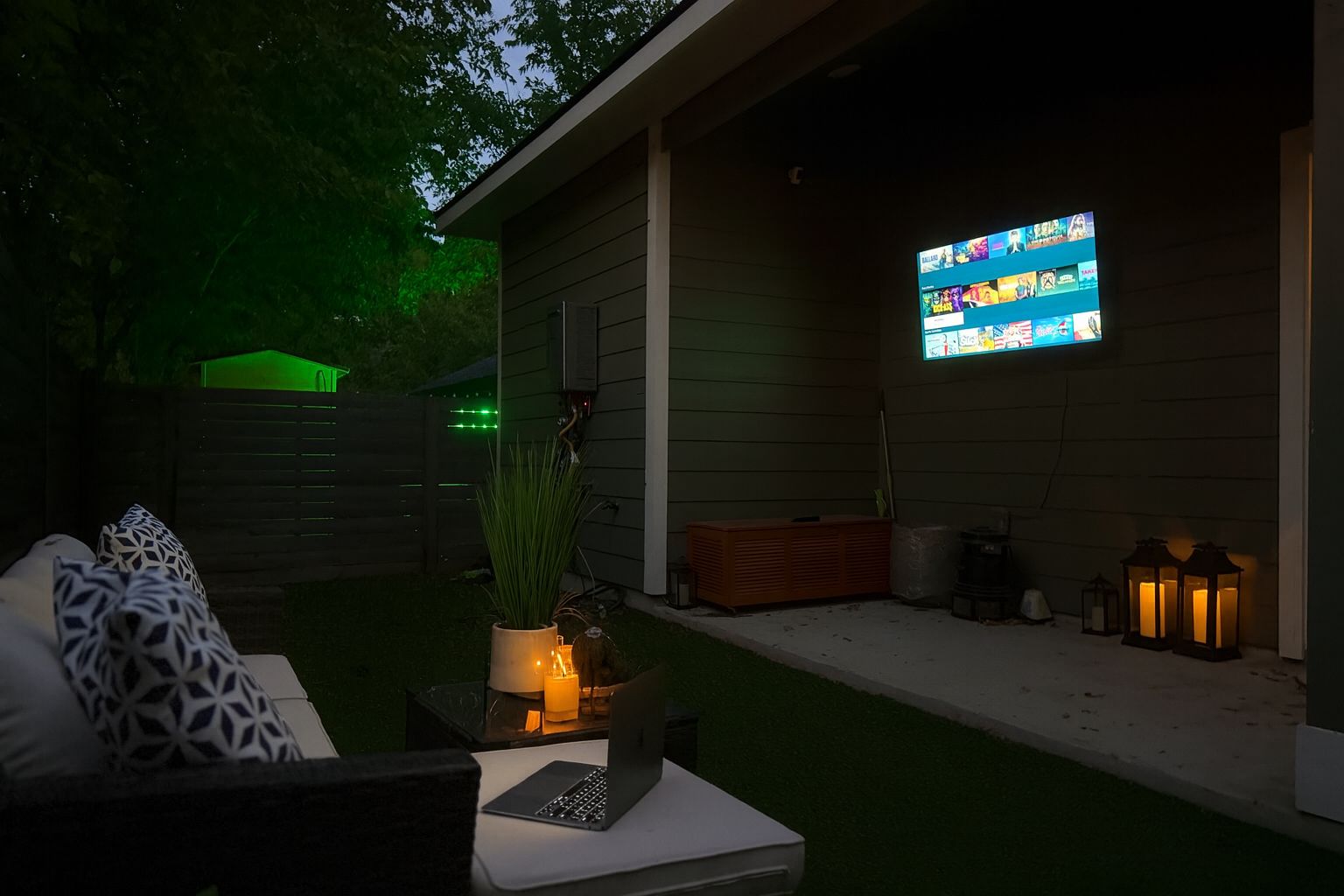 outdoor covered patio with TV, gas heater, blanket, sitting area, cozy game or movie time!