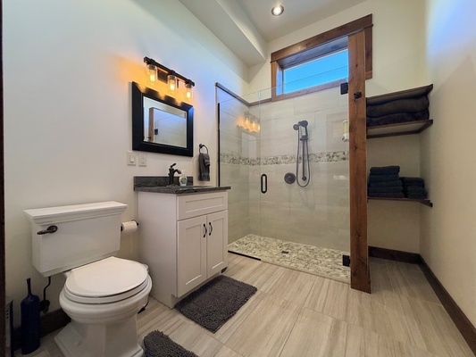 The suite features a full walk in shower.