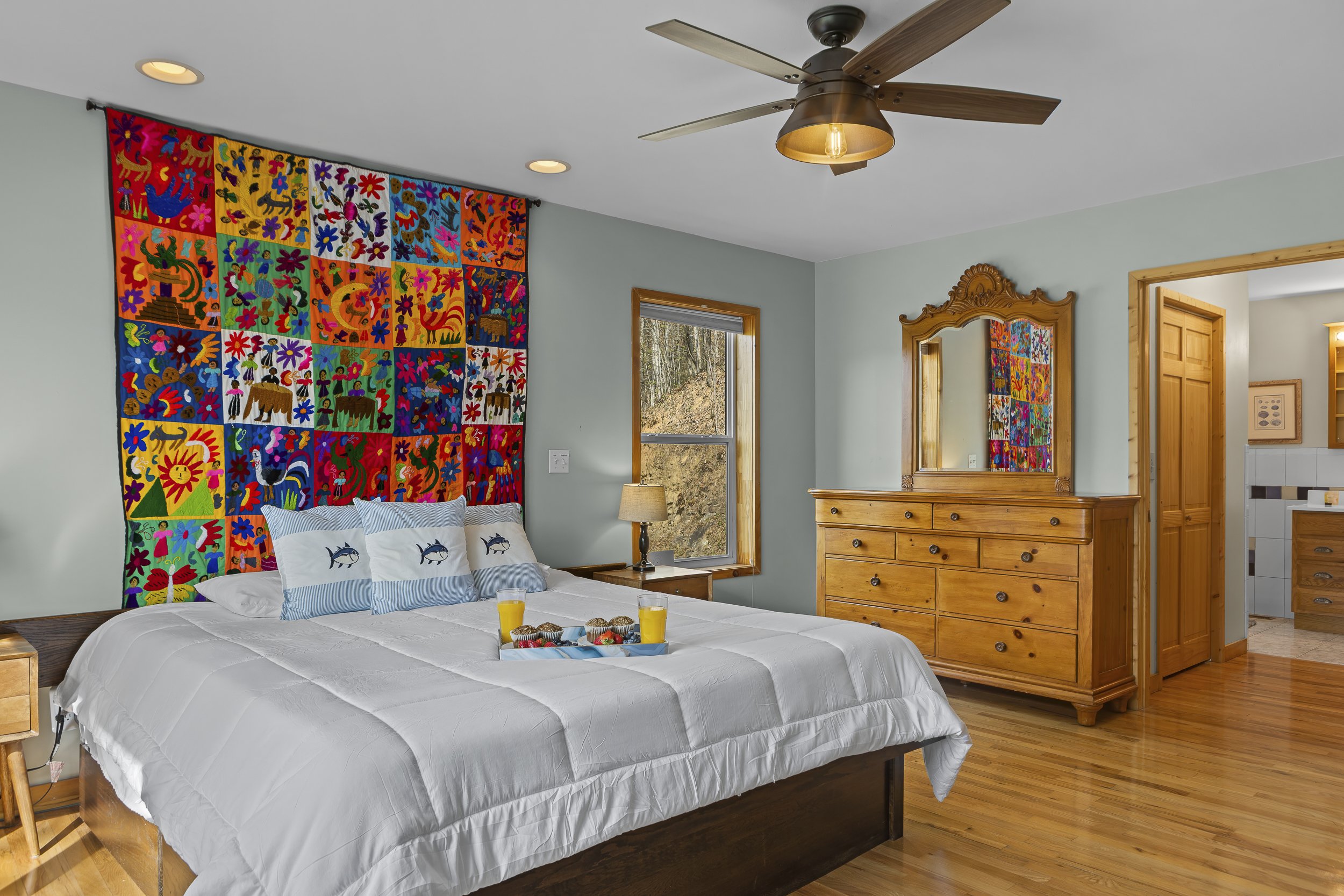 King Bedroom 2: Vibrant mural and sunlit spaces invite you to unwind in style!