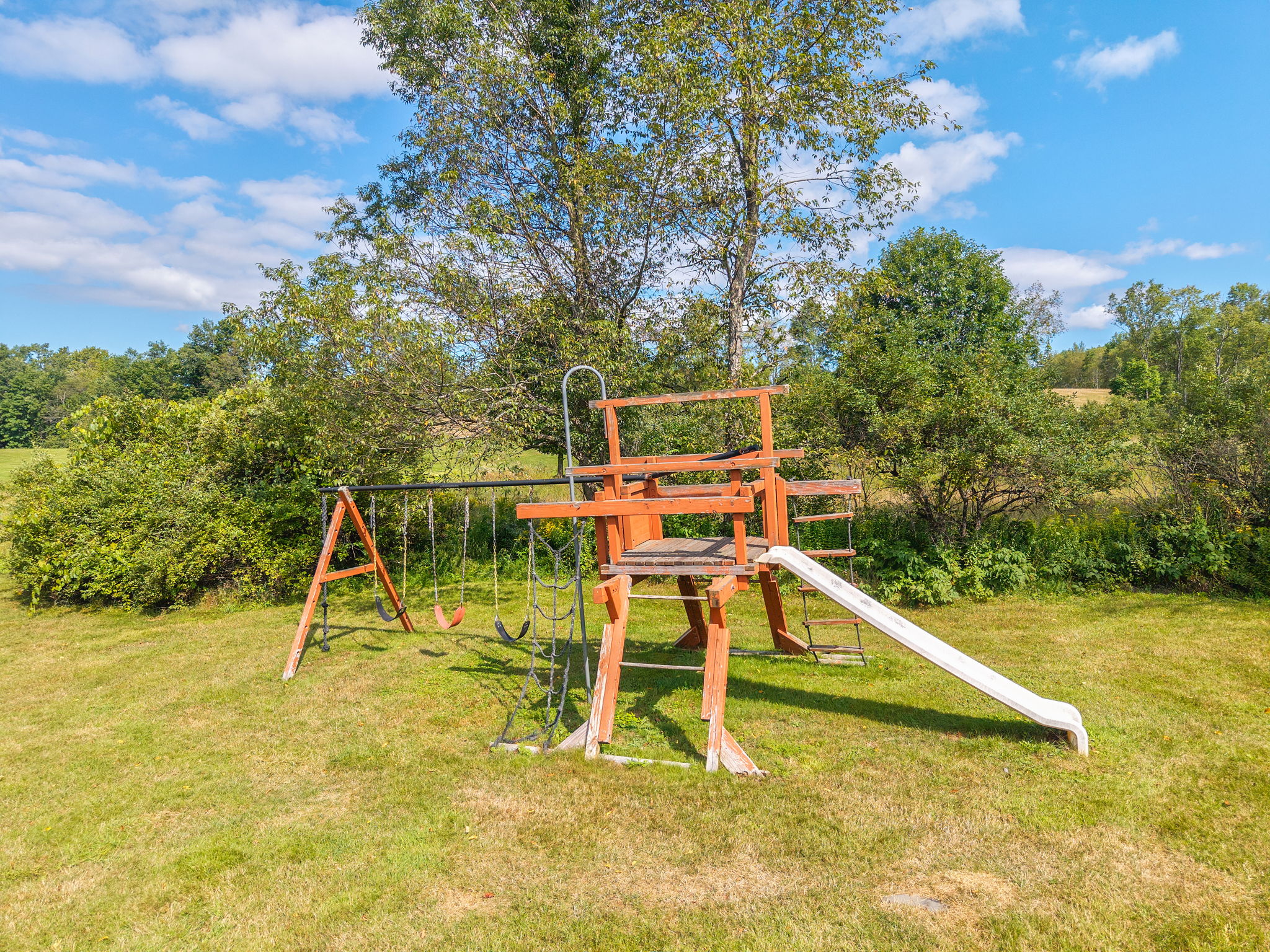 A shared playset gives younger guests a place to enjoy the outdoors.