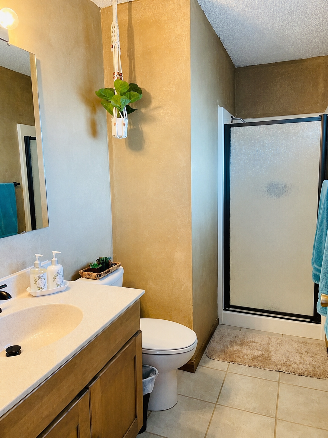 Bathroom vanity beside the walk-in shower