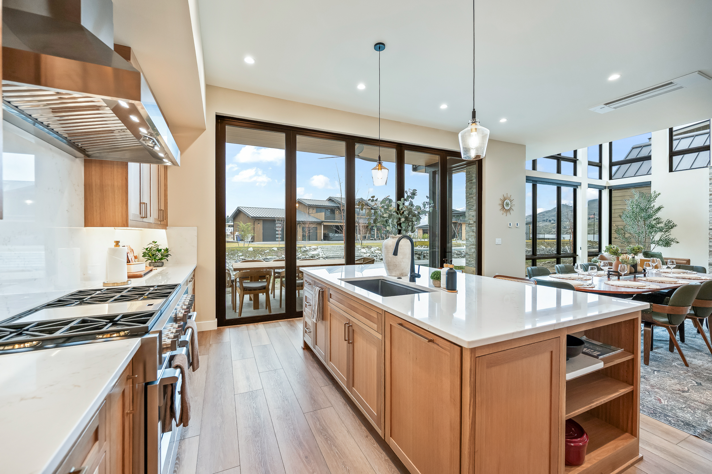 Dreamy chef's kitchen with custom cabinets, 6-burner gas stove, island seating, fully loaded with everything you need for your group. 