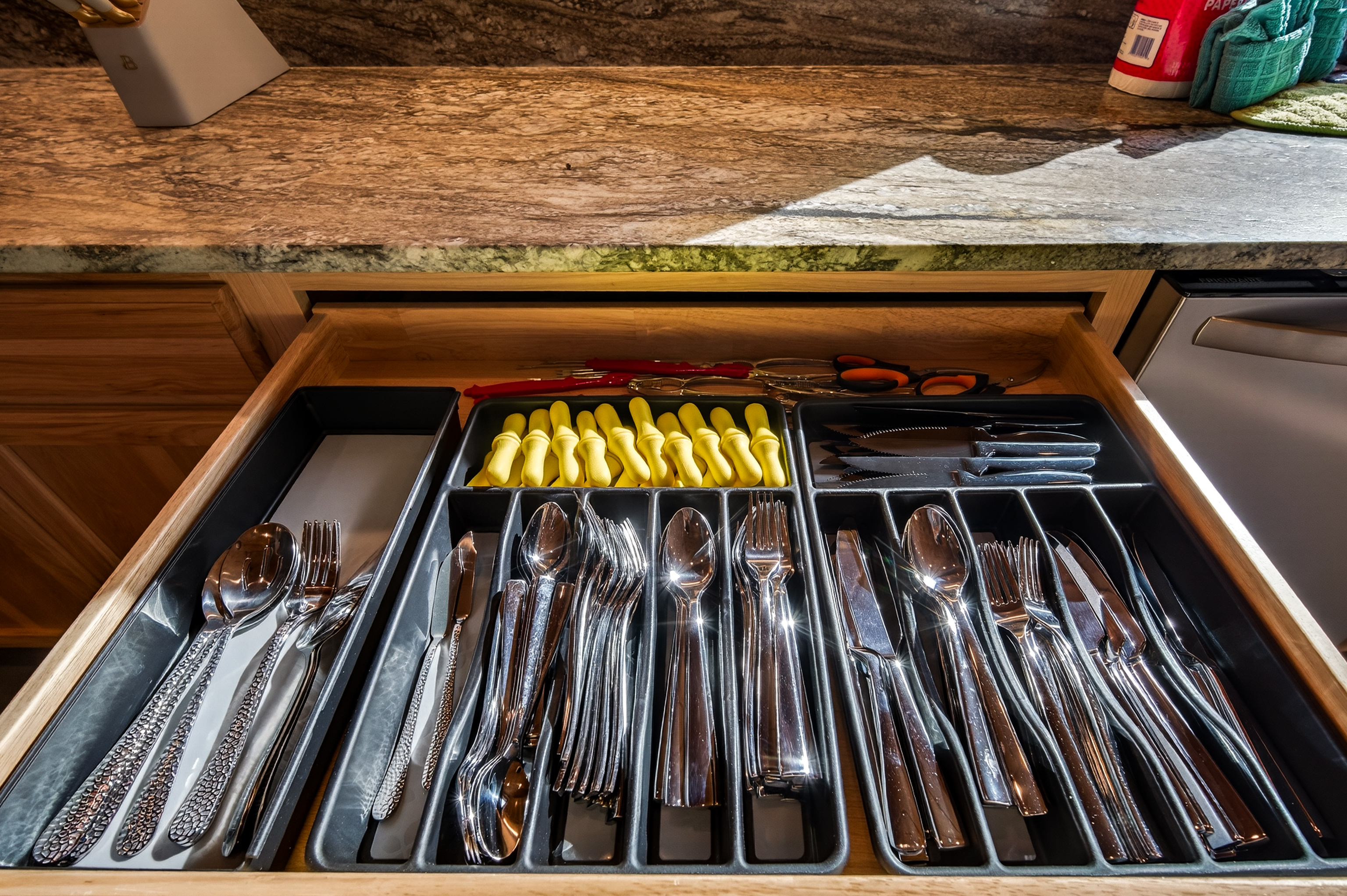 Silverware so that everyone in the group can eat at the same time and a load in the dishwasher! Corn on the cob holders, seafood utensils - shell cracker, shellers, crab forks, scissors and of course steak knives!