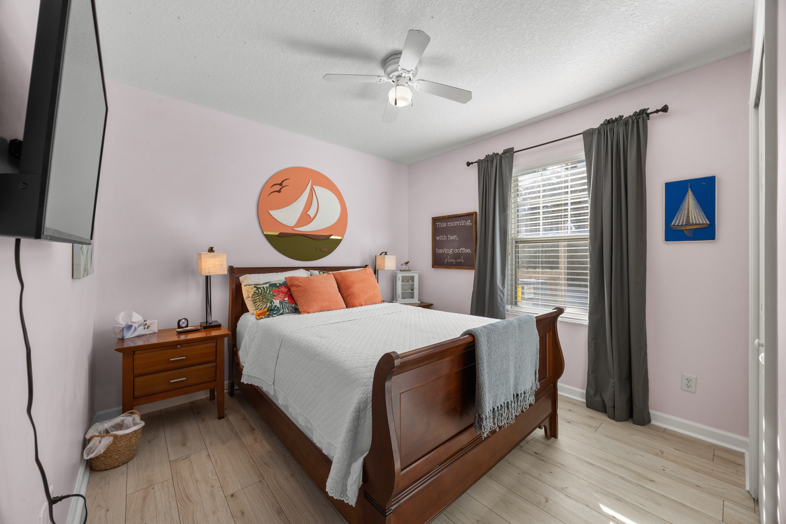 Well-appointed bedroom with soft tones and modern coastal décor.