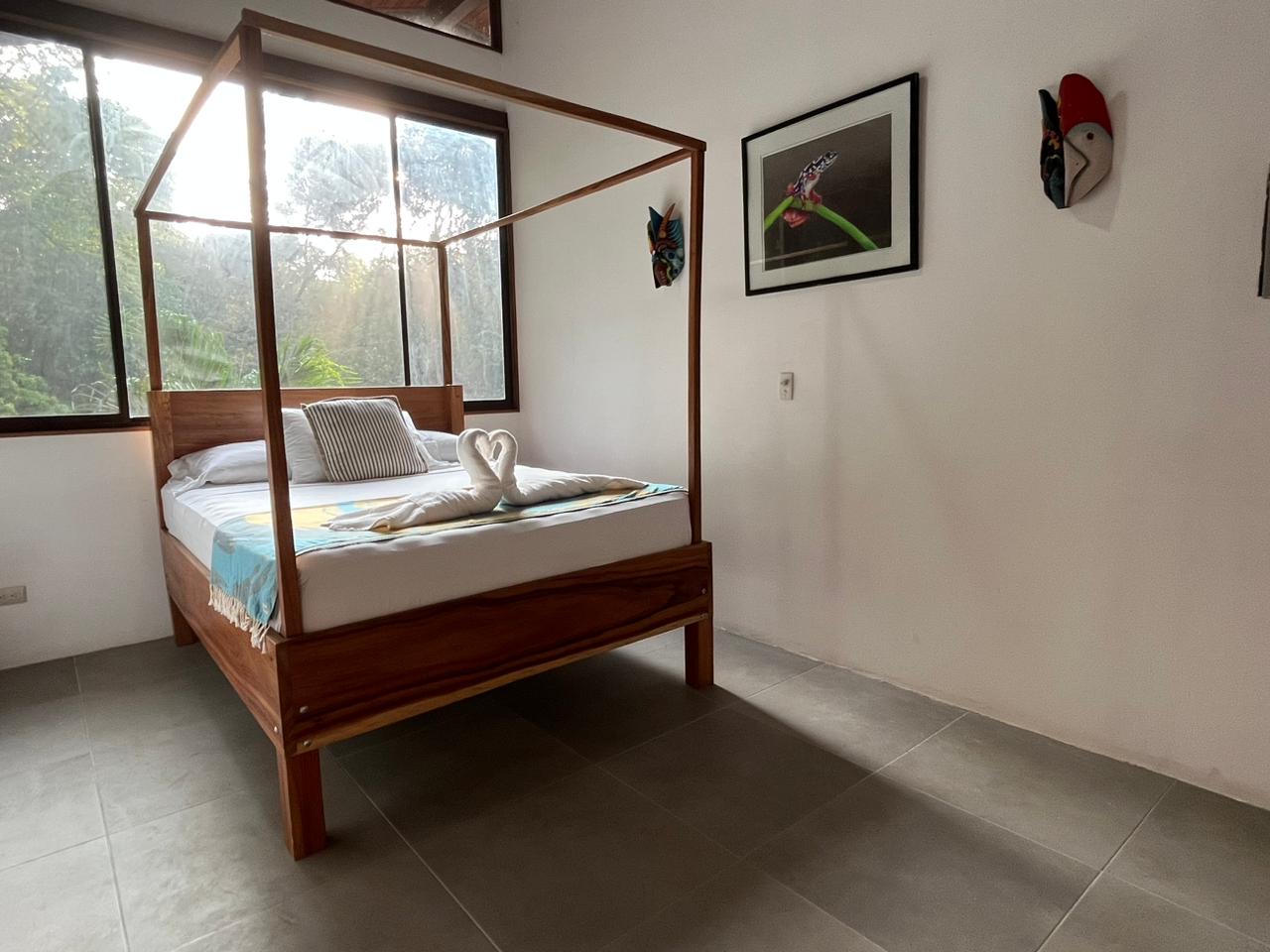 Serenely surrounded by trees in the master suite of Casa Mono.