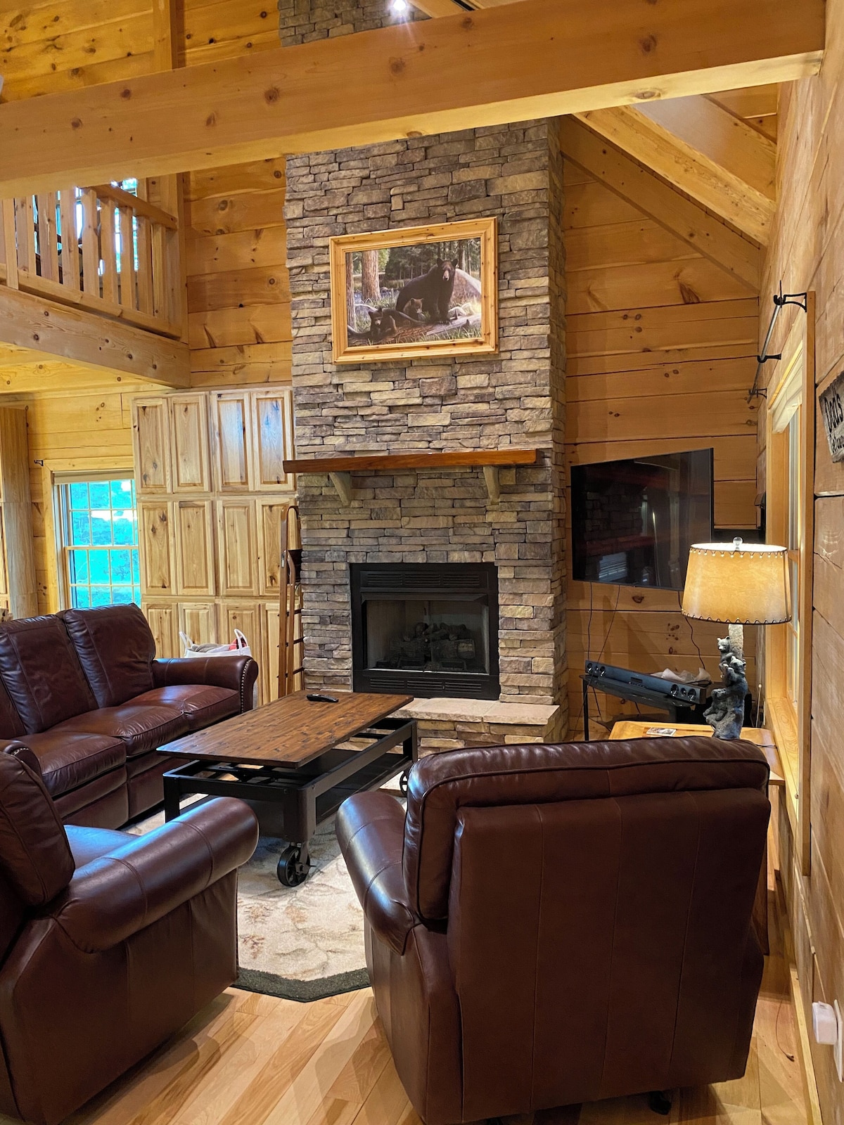 The Living Room has high-quality leather furniture and a coffee table that lifts up as more space to eat on.