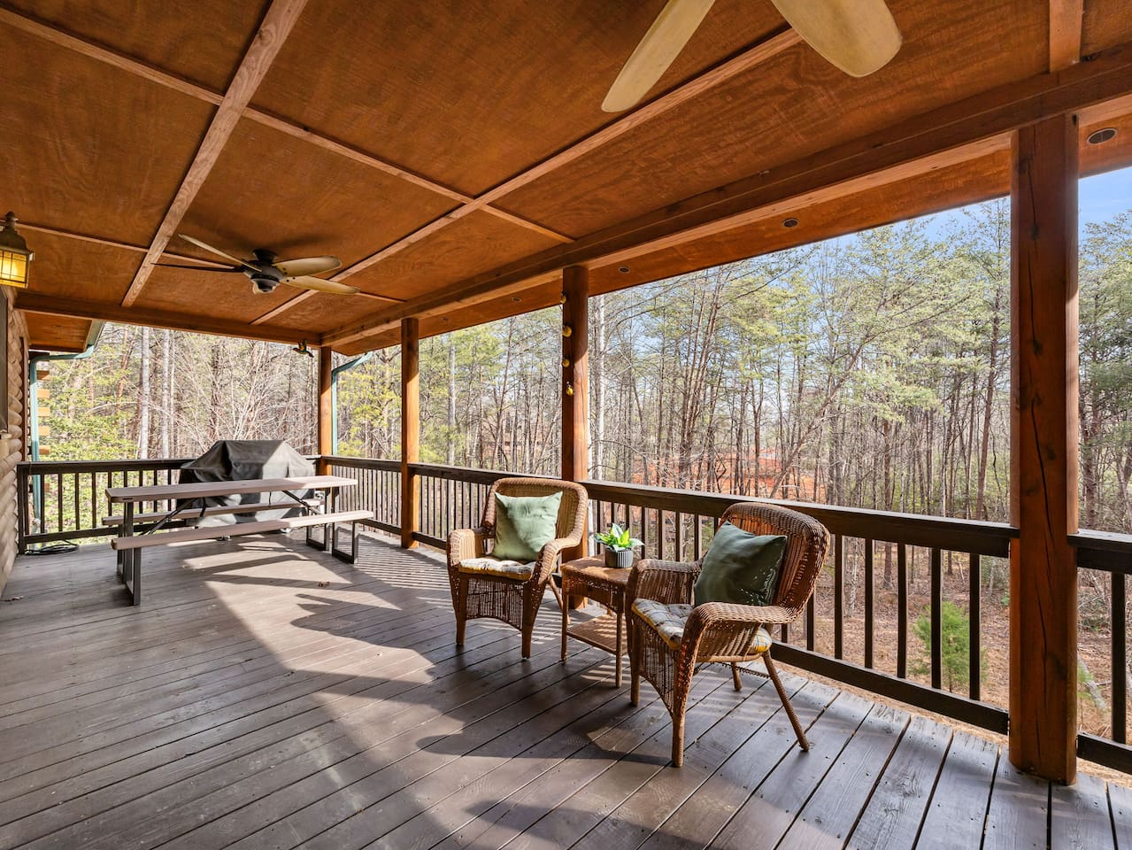 Covered deck area located on the main level of the cabin
