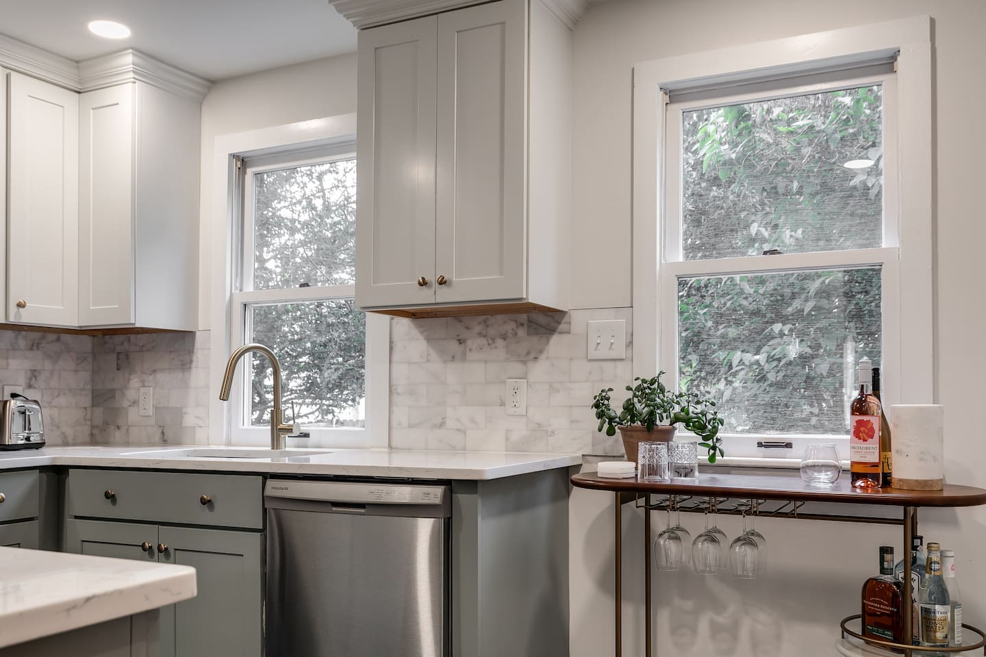 Kitchen: Cook and relax in this stylish, sunlit retreat with modern finishes and thoughtful touches!