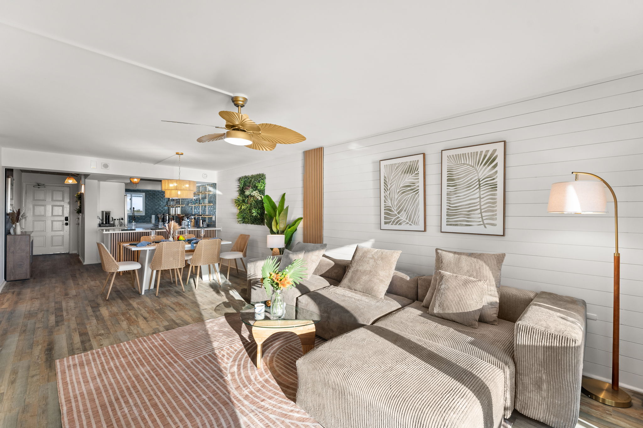 The living room also includes a ceiling fan and couch side reading light