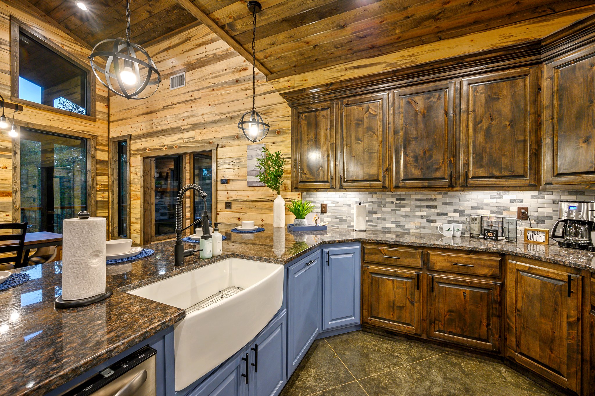 Modern rustic kitchen featuring granite counters and warm under-cabinet glow.
