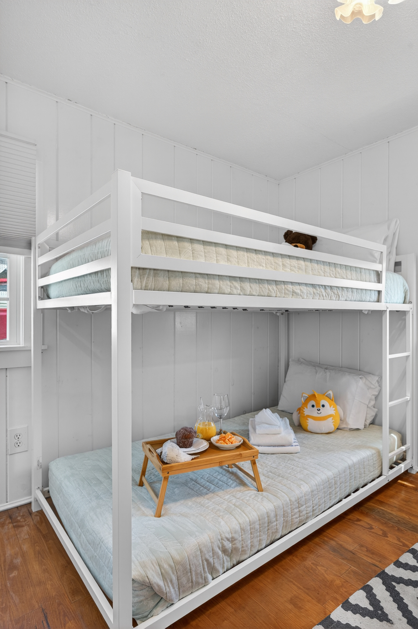 Cozy secondary sleeping space featuring twin bunk beds and efficient layout.