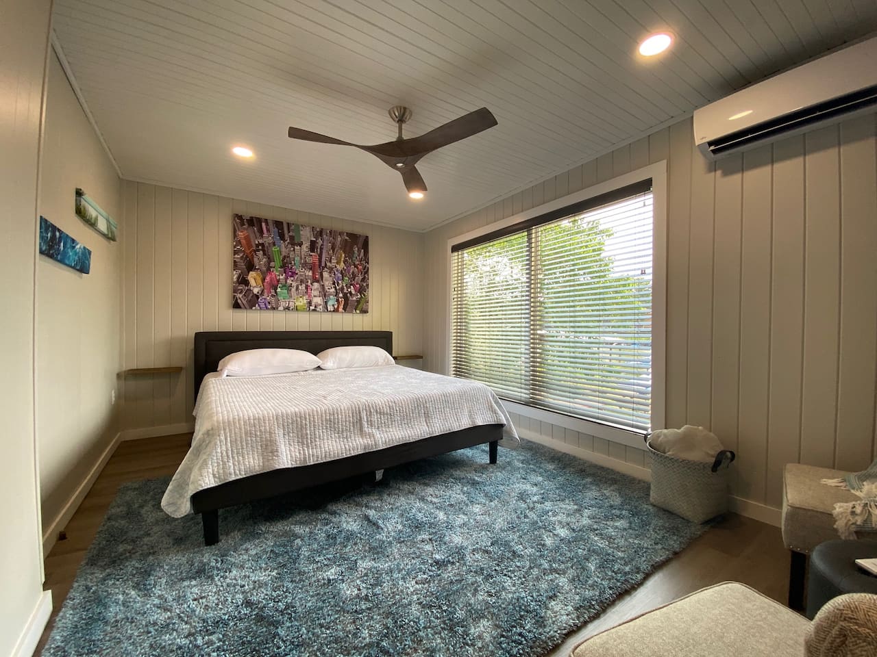 The King Bed features a Purple Mattress, Lake Views, Bedside Tables, a Smart TV and a Mini Split for Maximum Climate Control!