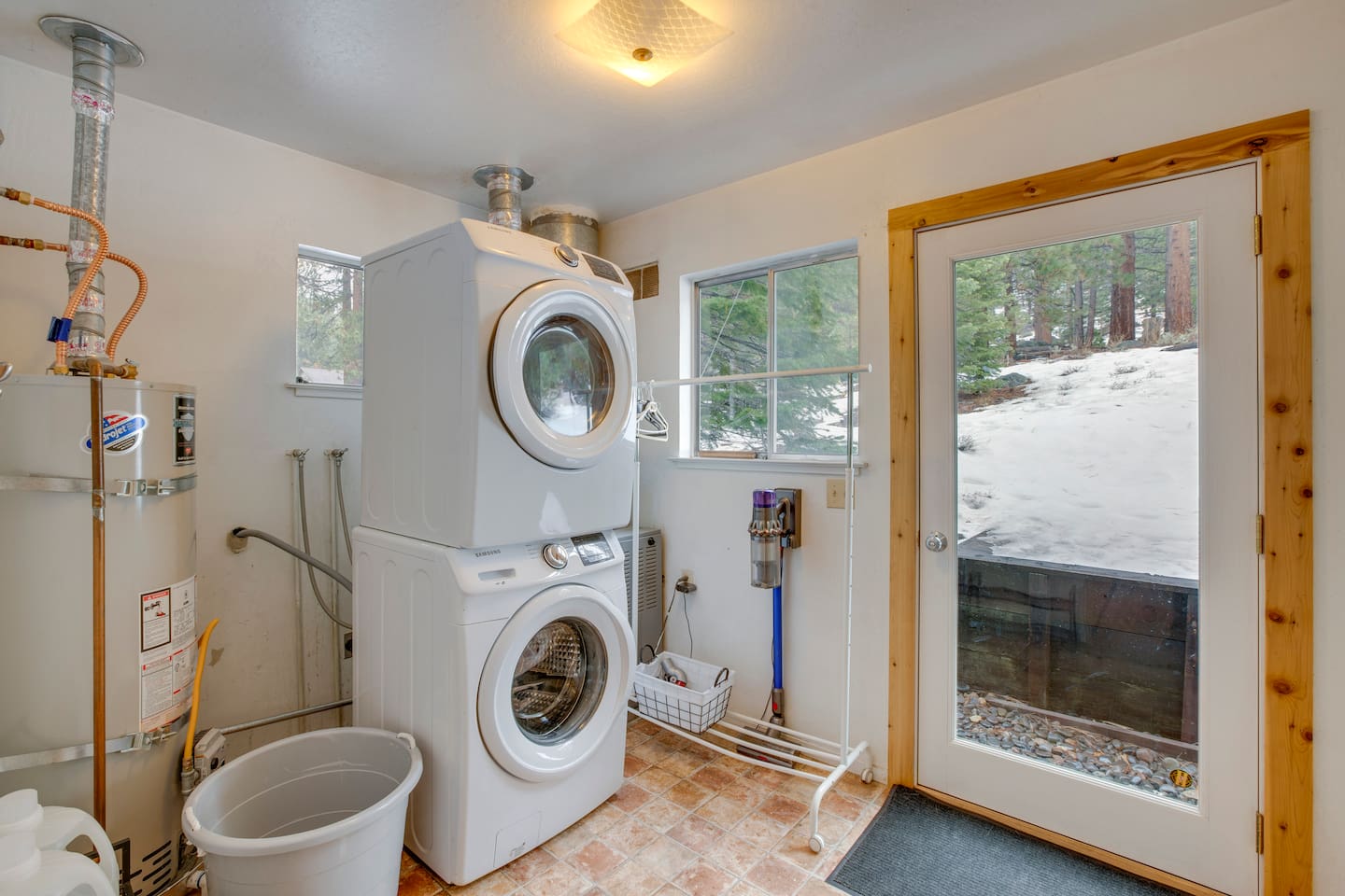 Laundry area with washer and dryer available for guest use.