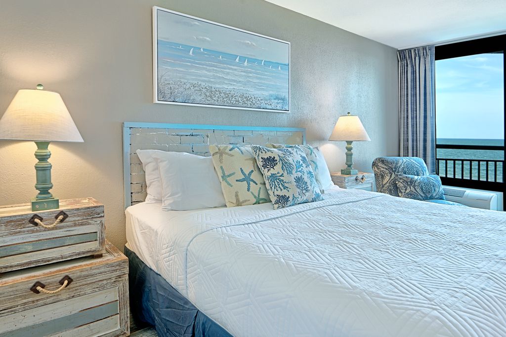 Rest up after a day in the sun in this plush, coastal-themed master suite.