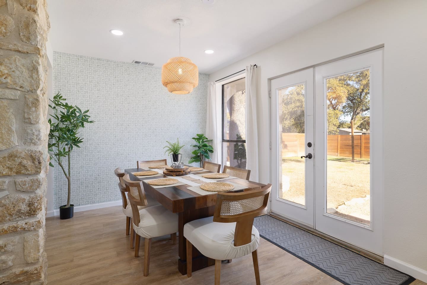 Sunlit mornings and shared dinners come naturally in this inviting dining space, with backyard views just steps away. A warm, welcoming setting designed for lingering meals and easy conversation.