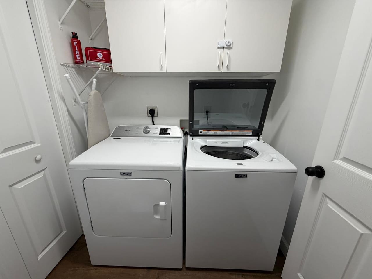 The laundry area features a full sized washer and dryer and an iron and ironing board.  A complimentary initial supply of laundry detergent is provided.  The fire extinguisher and first aid kit can be found in the laundry room.