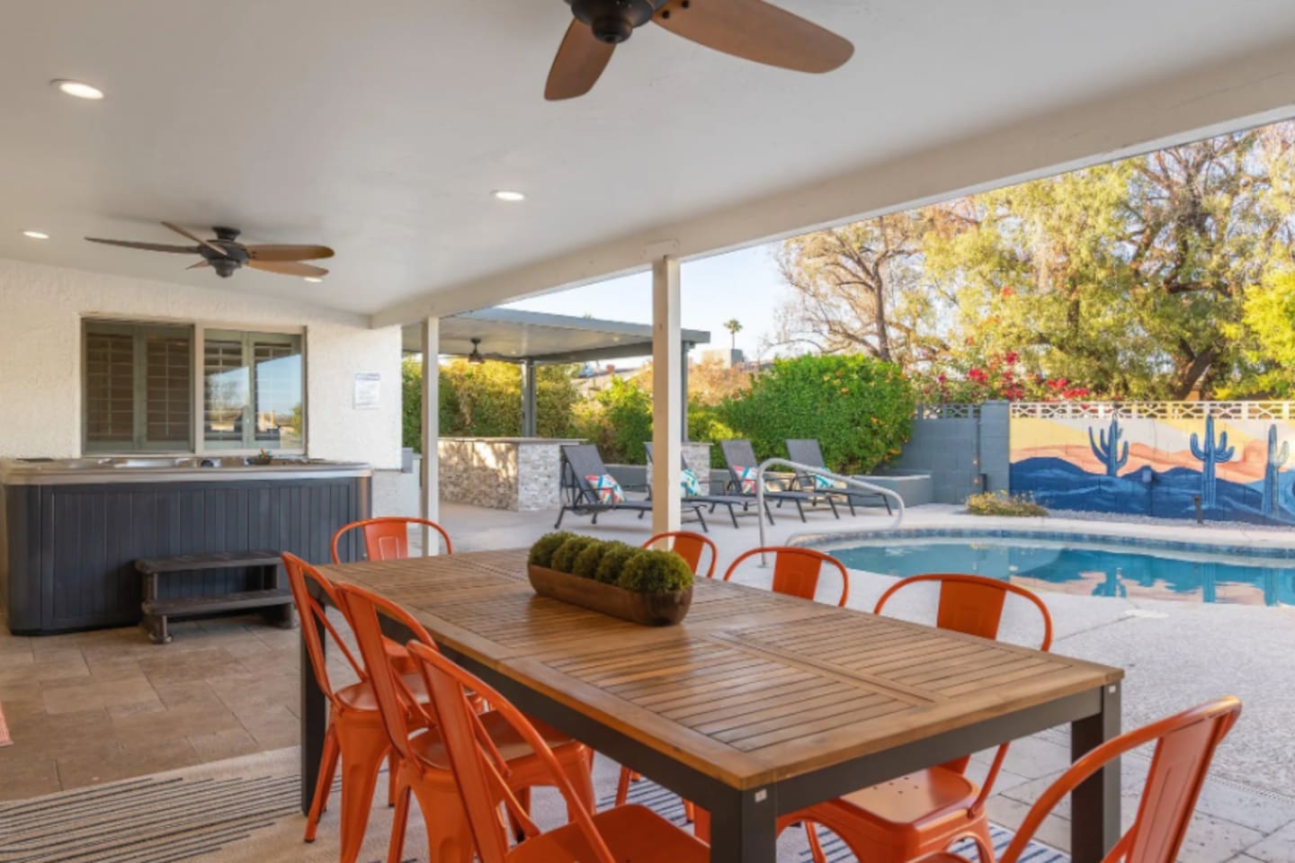 A shaded dining table seats the whole group right poolside, so meals never mean stepping away from the fun.
