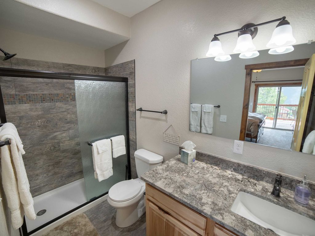 Main Level Bedroom En Suite Bathroom 1 with modern rustic touches with convenient access.