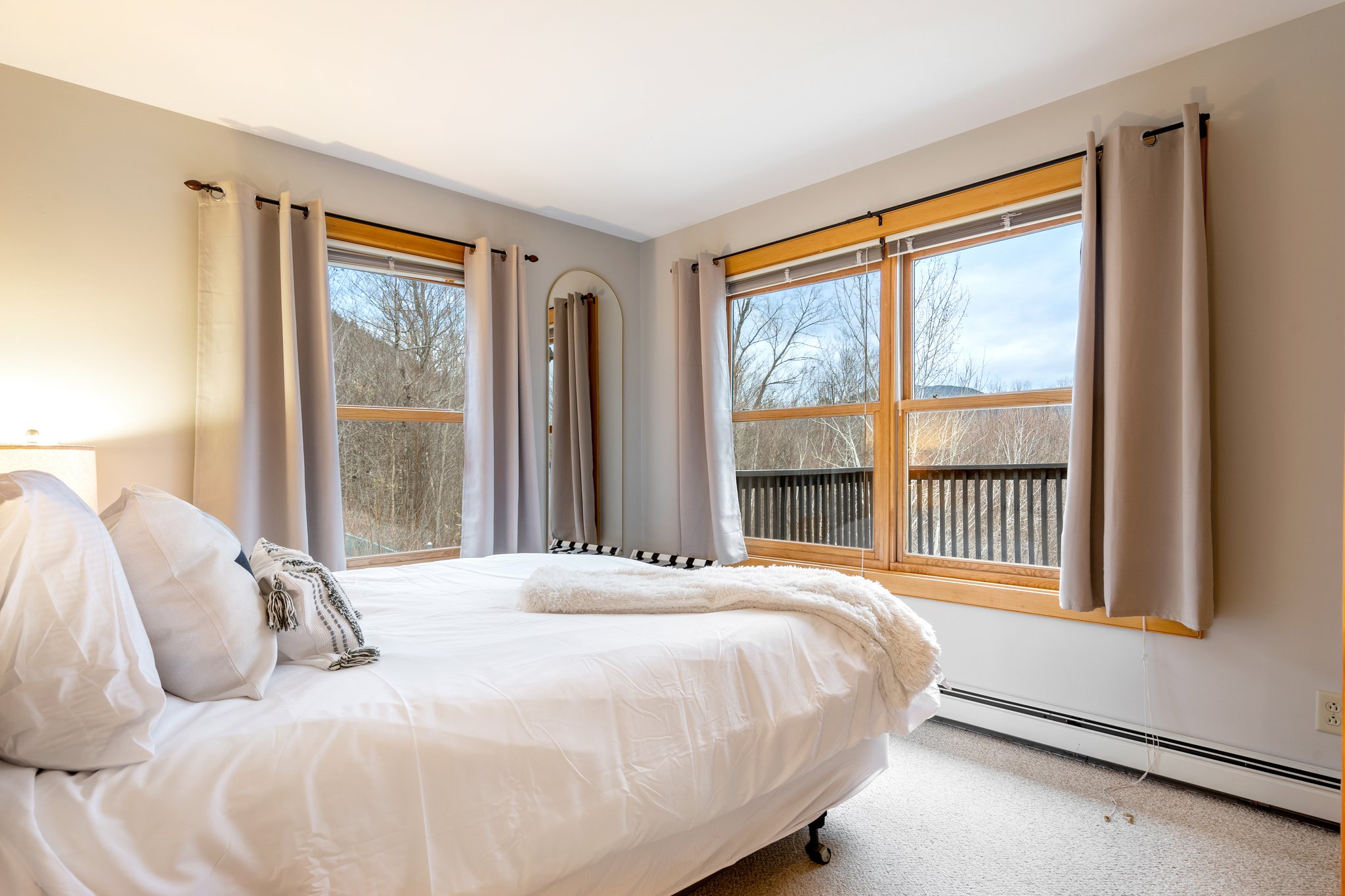 Wake refreshed in a bright bedroom with mountain views that make every morning feel like part of the escape.