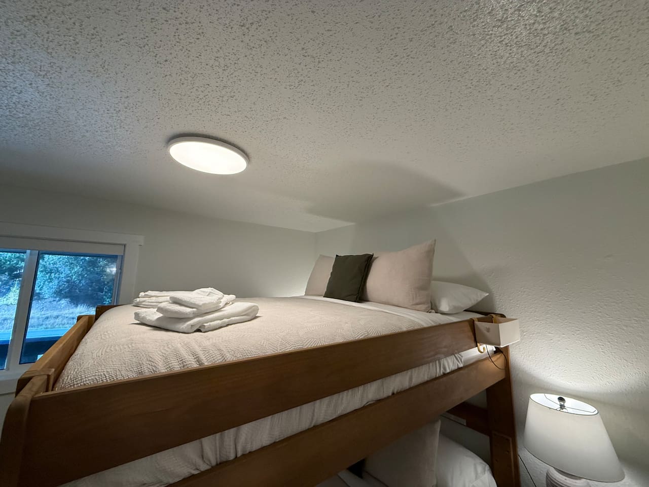Enjoy comfortable sleeping in the top bunk, designed for a restful night's sleep in a compact, efficient space.