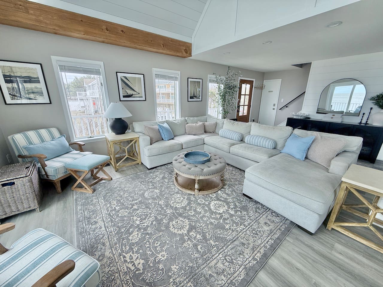 Relax in this spacious and inviting living area, perfect for unwinding in style. Featuring plush, comfortable seating, coastal-inspired decor, and ample space for the whole group, it is an ideal spot for luxury comfort.