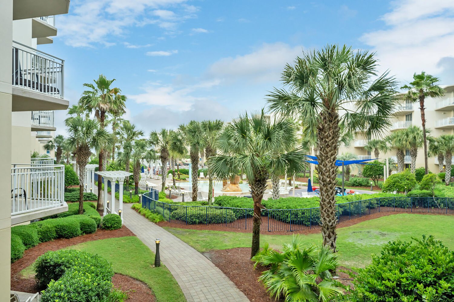 Landscaped resort grounds  and splash pad view from balcony