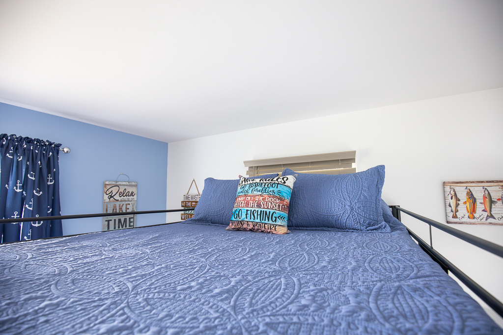 Both kids and adults will love the Upstairs Bunkroom with two twin-over-full bunk beds