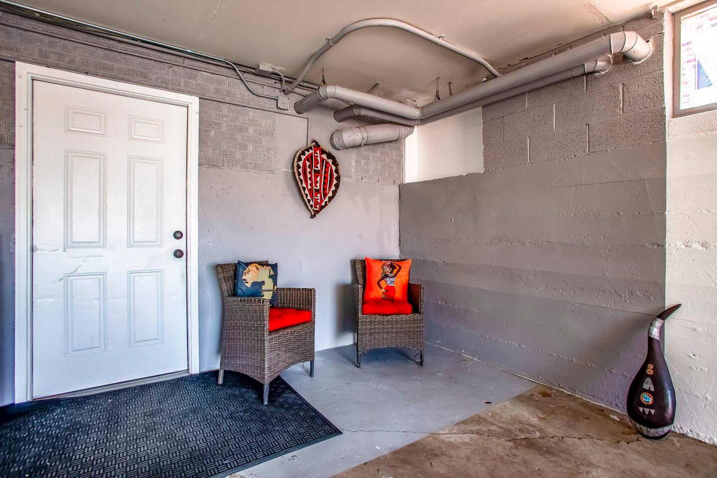 Attached garage with sitting area.