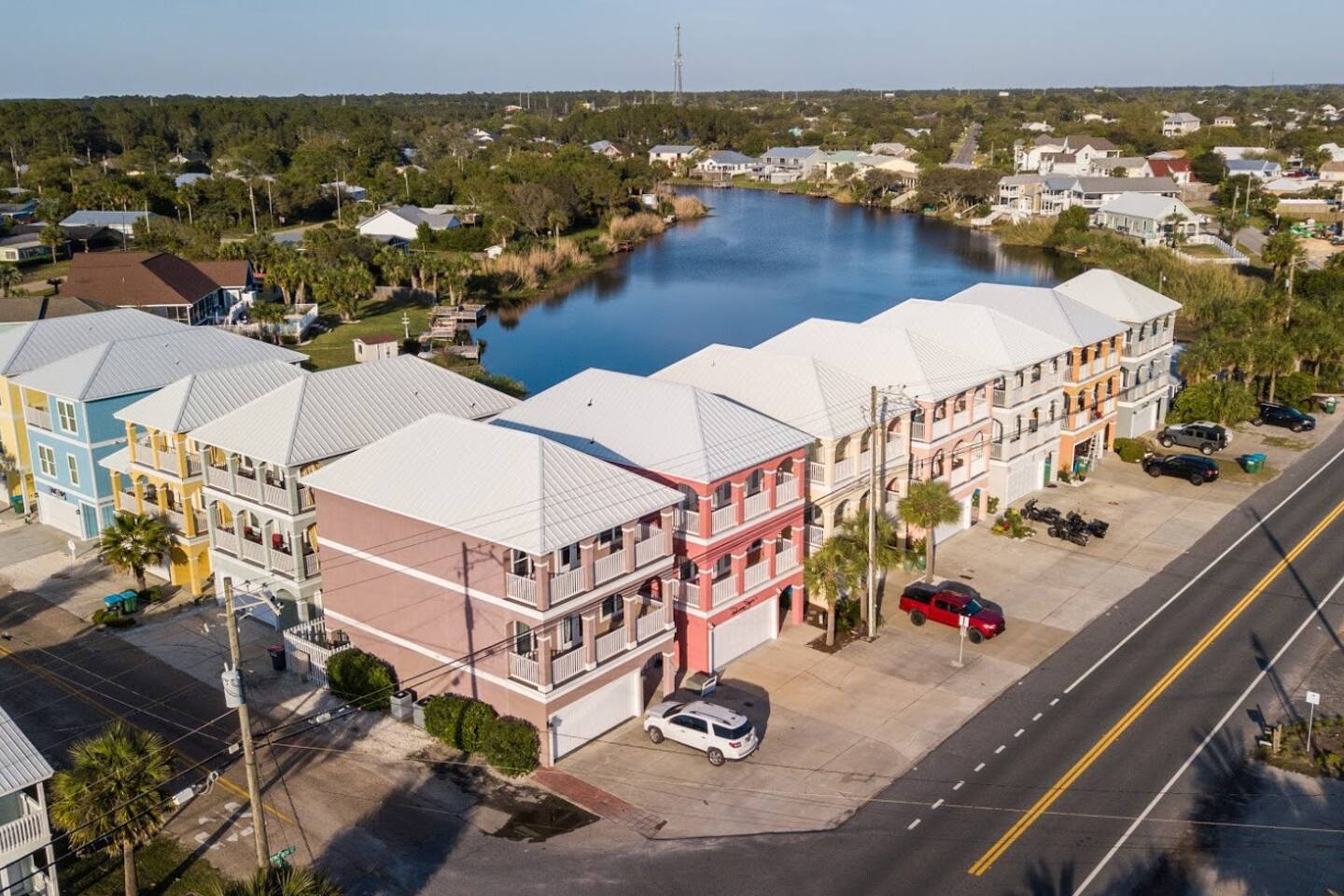 Drone view of Riviera Beach Villas and Panama Jane's and the dune lake behind.