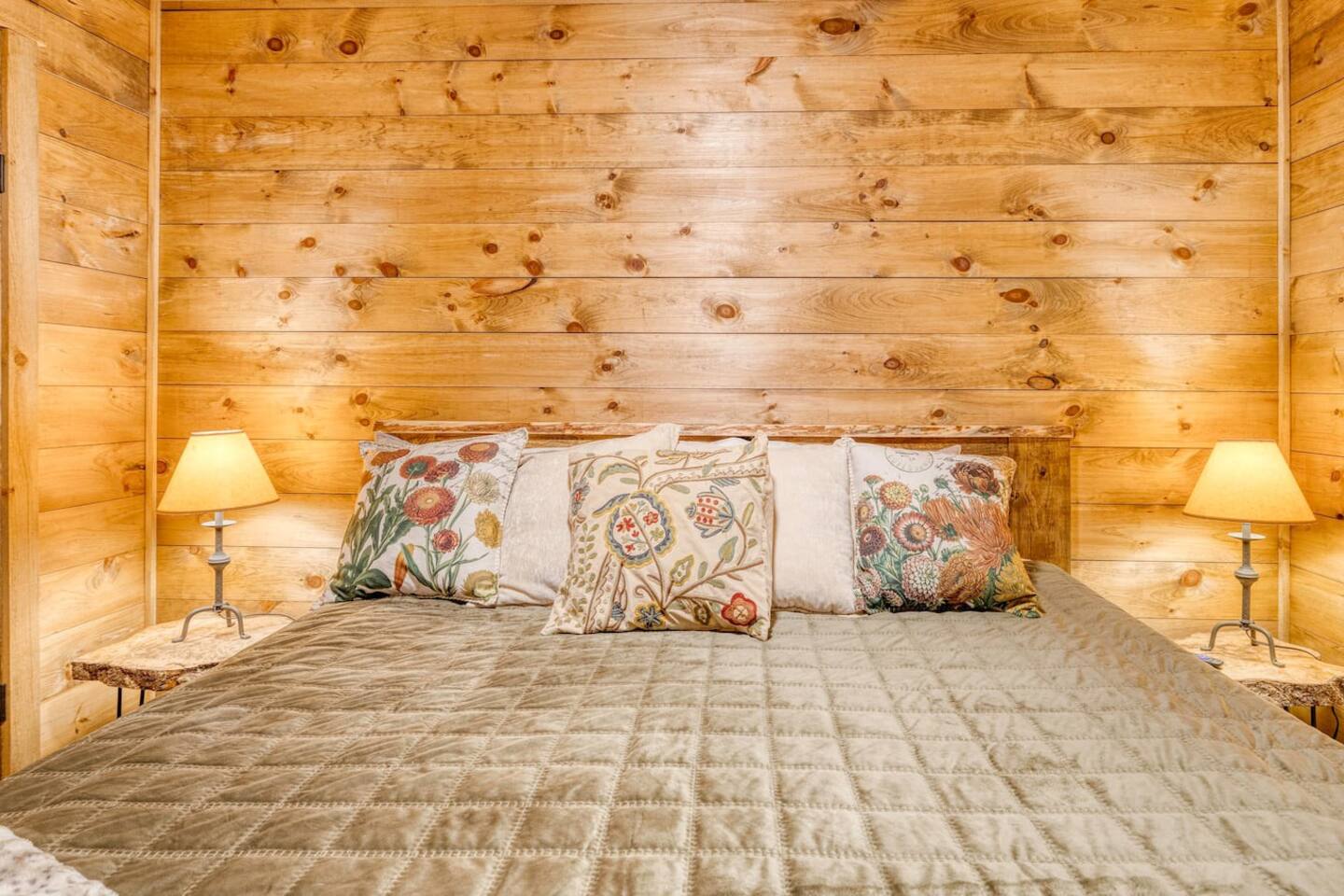 Sink into our warm, cozy bed like a hug from a loved one, where soft blankets and plush pillows await to cradle you into a blissful night's sleep.