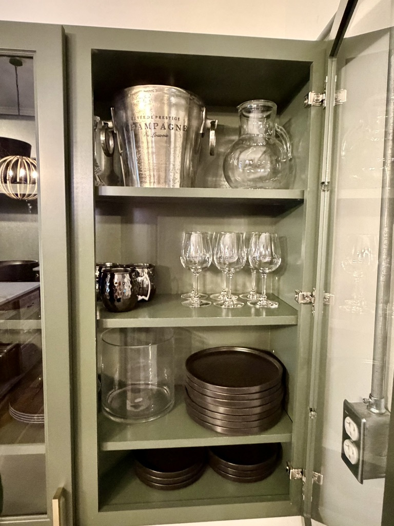 Full equipped kitchen with pots and pans, dishesm and stemware