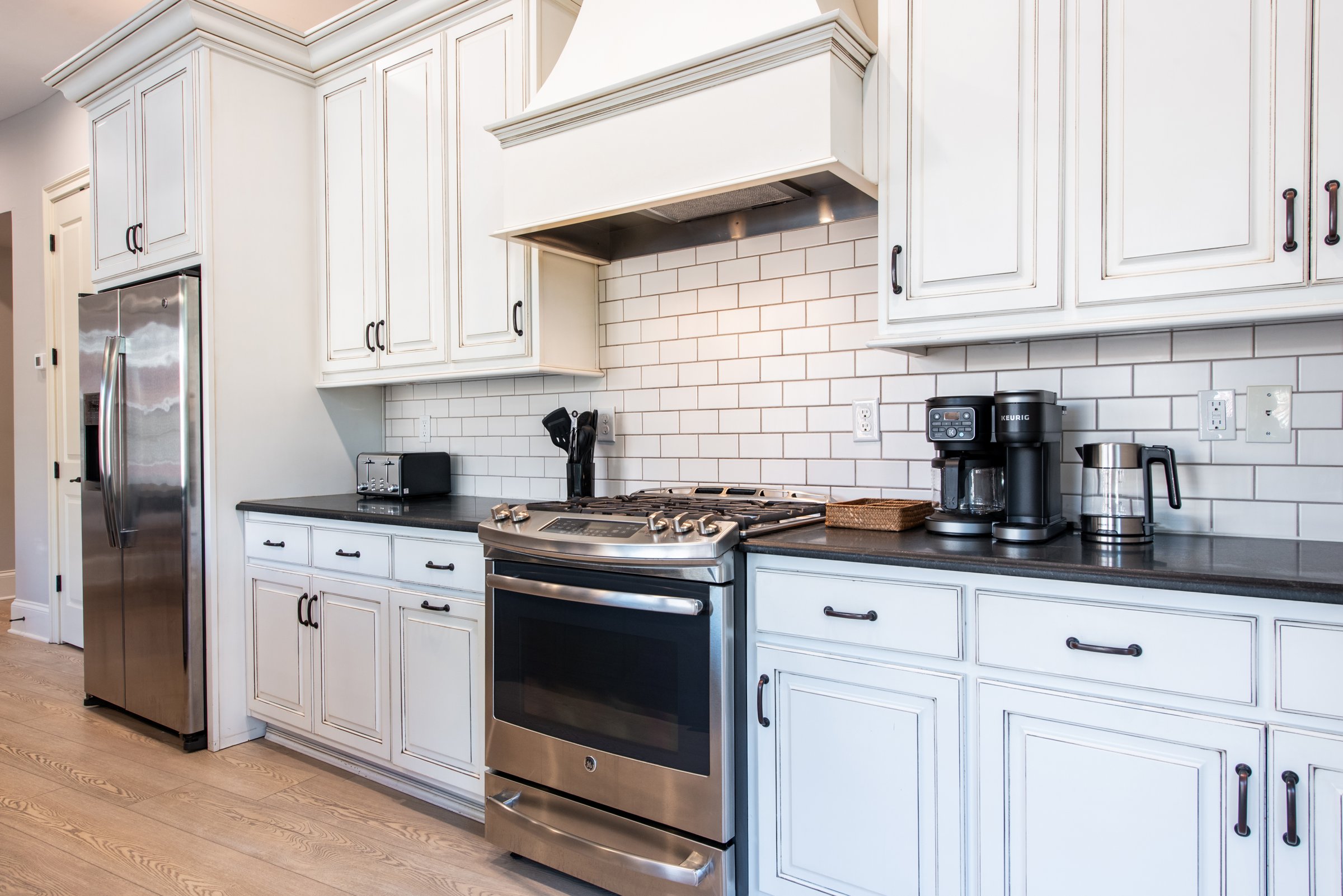 Gas range and subway tile backsplash - everything you need for a home-cooked meal.